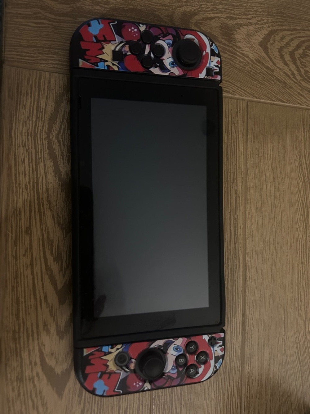 Nintendo Switch with Red, Blue, Black Graphic Controller Wraps